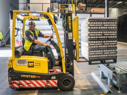 Working manning forklift in warehouse